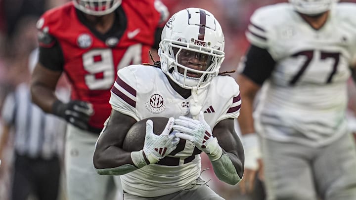 Mississippi State Bulldogs running back Davon Booth (21) runs the ball against the Georgia Bulldogs at Sanford Stadium.