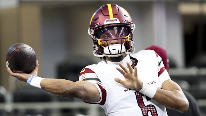 Jan 5, 2025; Arlington, Texas, USA;  Washington Commanders quarterback Jayden Daniels (5) warms up before the game against the Dallas Cowboys at AT&T Stadium. Mandatory Credit: Kevin Jairaj-Imagn Images