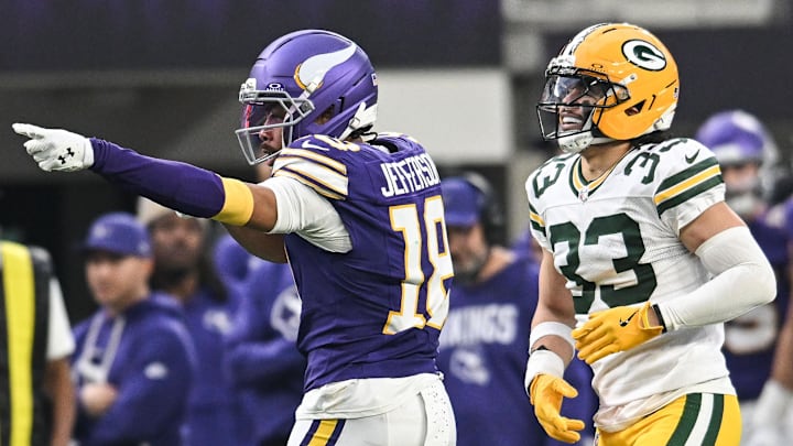 Jan 4, 2026; Minneapolis, Minnesota, USA; Minnesota Vikings wide receiver Justin Jefferson (18) celebrates after a play in front of Green Bay Packers safety Evan Williams (33) during the second quarter at U.S. Bank Stadium.
