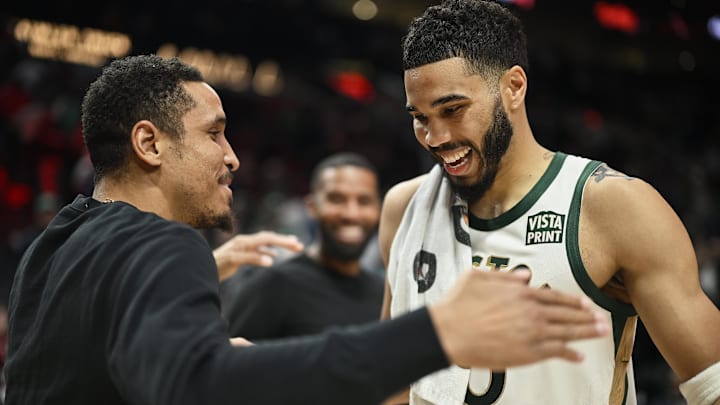 Mar 11, 2024; Portland, Oregon, USA; Boston Celtics forward Jayson Tatum (0) embraces former teammate Portland Trail Blazers guard Malcolm Brogdon (11) after a game at Moda Center. Mandatory Credit: Troy Wayrynen-Imagn Images