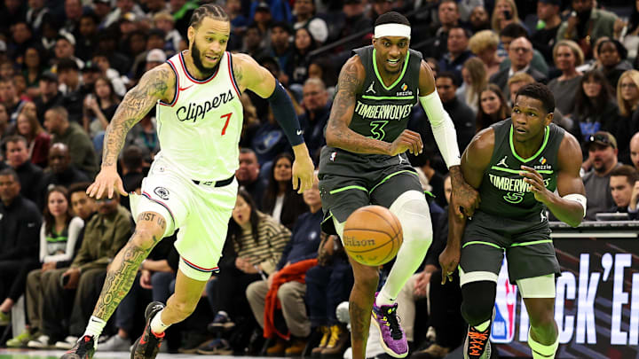 Minnesota Timberwolves forward Jaden McDaniels and Los Angeles Clippers guard Amir Coffey (7) compete for the ball during the first quarter of an NBA Cup game at Target Center in Minneapolis on Nov. 29, 2024. Minnesota Timberwolves forward Jaden McDaniels and Los Angeles Clippers guard Amir Coffey (7) compete for the ball during the first quarter of an NBA Cup game at Target Center in Minneapolis on Nov. 29, 2024.