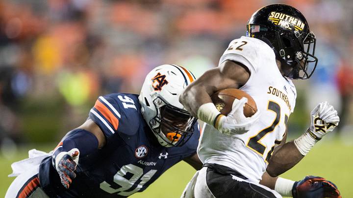 Auburn's Nick Coe (91) dives at Southern Miss. Trivenskey Mosley (22) at Jordan-Hare Stadium in Auburn, Ala., on Saturday, Sept. 29, 2018. Auburn defeated Southern Miss 24-13. Auburn's Nick Coe (91) dives at Southern Miss. Trivenskey Mosley (22) at Jordan-Hare Stadium in Auburn, Ala., on Saturday, Sept. 29, 2018. Auburn defeated Southern Miss 24-13.
