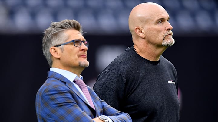 Former general manager Thomas Dimitroff and former head coach Dan Quinn look on before a game