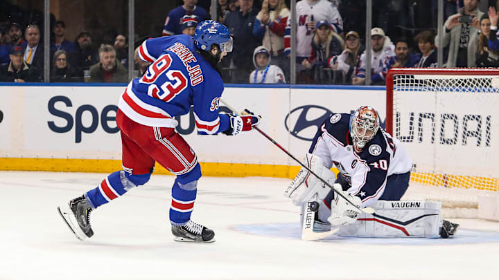 Jan 18, 2025; New York, New York, USA; New York Rangers center Mika Zibanejad (93) takes a shot at Columbus Blue Jackets goalie Daniil Tarasov (40) in a shootout at Madison Square Garden. Mandatory Credit: Danny Wild-Imagn Images