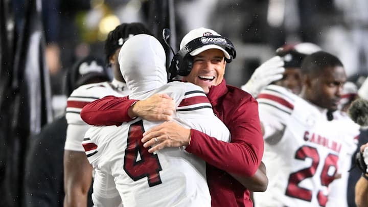 Nov 9, 2024; Nashville, Tennessee, USA;  South Carolina Gamecocks head coach Shane Beamer celebrates the win with defensive back Vicari Swain (4) against the Vanderbilt Commodores during the second half at FirstBank Stadium. Mandatory Credit: Steve Roberts-Imagn Images