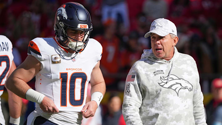 Nov 10, 2024; Kansas City, Missouri, USA; Denver Broncos quarterback Bo Nix (10) talks with head coach Sean Payton against the Kansas City Chiefs prior to a game at GEHA Field at Arrowhead Stadium. 