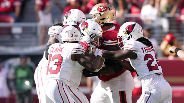 Oct 6, 2024; Santa Clara, California, USA; Arizona Cardinals linebacker Kyzir White (center left) celebrates with teammates after intercepting a pass against the San Francisco 49ers during the fourth quarter at Levi's Stadium. Mandatory Credit: Darren Yamashita-Imagn Images