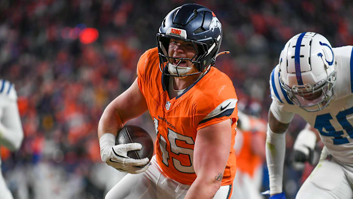 DENVER, CO - DECEMBER 15: Denver tight end Nate Adkins (45) runs the ball and scores a touchdown during a game between the Indianapolis Colts and the Denver Broncos at Empower Field at Mile High in Denver, CO on December 15, 2024. DENVER, CO - DECEMBER 15: Denver tight end Nate Adkins (45) runs the ball and scores a touchdown during a game between the Indianapolis Colts and the Denver Broncos at Empower Field at Mile High in Denver, CO on December 15, 2024.