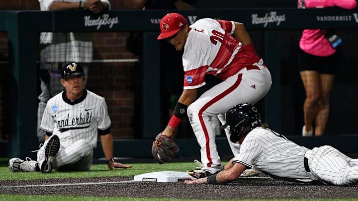 Vanderbilt’s Brodie Johnston (9) slides safely into third base ahead of the tag by Louisville's Jake Munroe (20) after a single hit by Braden Holcomb as head coach Tim Corbin watches during the sixth inning of the Nashville Regional NCAA Baseball Tournament game at Hawkins Field Saturday, May 31, 2025, in Nashville, Tenn. Vanderbilt’s Brodie Johnston (9) slides safely into third base ahead of the tag by Louisville's Jake Munroe (20) after a single hit by Braden Holcomb as head coach Tim Corbin watches during the sixth inning of the Nashville Regional NCAA Baseball Tournament game at Hawkins Field Saturday, May 31, 2025, in Nashville, Tenn.