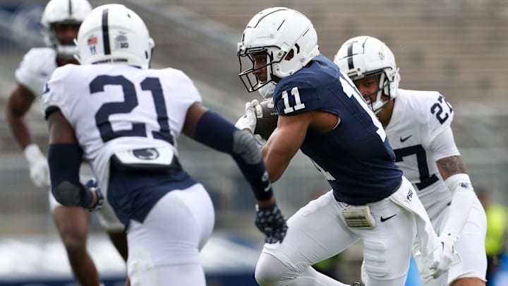 Penn State Nittany Lions wide receiver Kyron Hudson (11) runs with the ball during the third quarter of the Blue-White spring game at Beaver Stadium. 