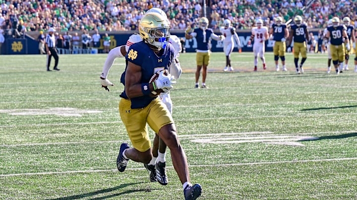 Sep 21, 2024; South Bend, Indiana, USA; Notre Dame Fighting Irish wide receiver Beaux Collins (5) catches a pass for a touchdown in the second quarter against the Miami Redhawks at Notre Dame Stadium.