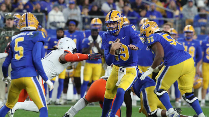 Nov 9, 2024; Pittsburgh, Pennsylvania, USA;  Pittsburgh Panthers quarterback Nate Yarnell (19) runs the ball against the Virginia Cavaliers during the third quarter at Acrisure Stadium. Mandatory Credit: Charles LeClaire-Imagn Images