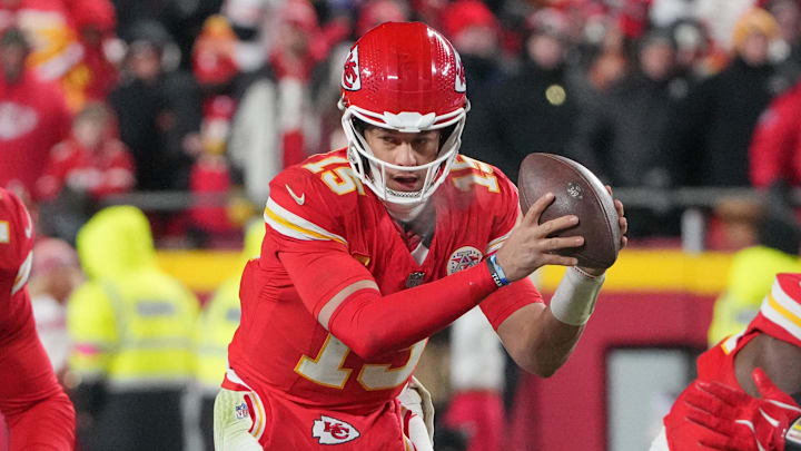 Jan 18, 2025; Kansas City, Missouri, USA; Kansas City Chiefs quarterback Patrick Mahomes (15) takes a snap against the Houston Texans during the second half of a 2025 AFC divisional round game at GEHA Field at Arrowhead Stadium.