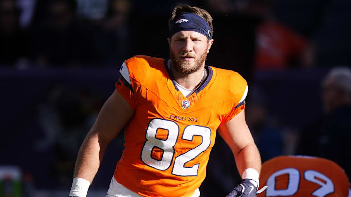 Dec 14, 2025; Denver, Colorado, USA; Denver Broncos tight end Adam Trautman (82) warms up before a game against the Green Bay Packers at Empower Field at Mile High. 