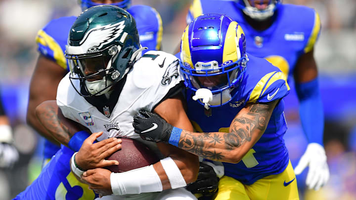 Oct 8, 2023; Inglewood, California, USA; Philadelphia Eagles quarterback Jalen Hurts (1) runs the ball against Los Angeles Rams linebacker Ernest Jones (53) and cornerback Ahkello Witherspoon (44) during the first half at SoFi Stadium. Mandatory Credit: Gary A. Vasquez-Imagn Images