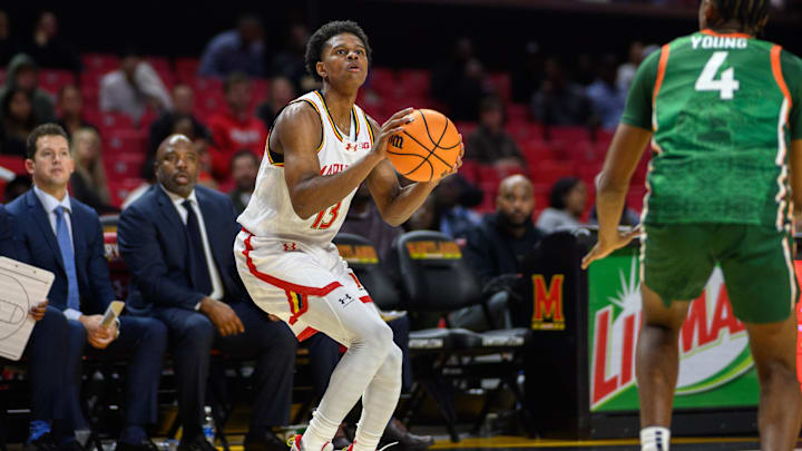 Nov 11, 2024; College Park, Maryland, USA; Maryland Terrapins guard Chance Stephens (13) takes a shot against Florida A&M Rattlers guard Sterling Young (4) during the second half at Xfinity Center. Nov 11, 2024; College Park, Maryland, USA; Maryland Terrapins guard Chance Stephens (13) takes a shot against Florida A&M Rattlers guard Sterling Young (4) during the second half at Xfinity Center.