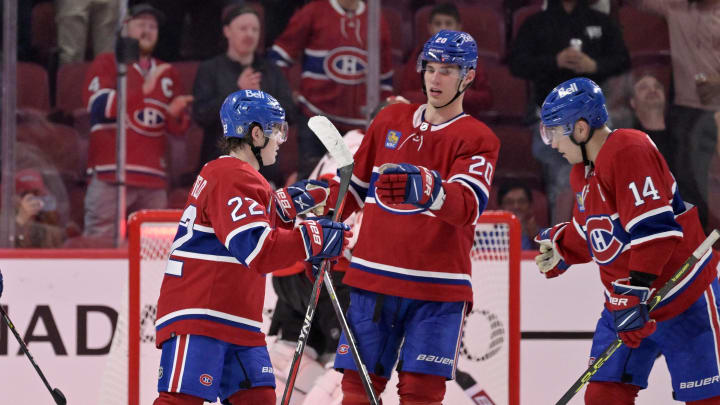 Oct 4, 2022; Montreal, Quebec, CAN; Montreal Canadiens forward Cole Caufield (22) celebrates with teammates including forward Juraj Slafkovsky (20) and forward Nick Suzuki (14) after scoring a goal against the Ottawa Senators during the third period at the Bell Centre. Mandatory Credit: Eric Bolte-USA TODAY Sports Oct 4, 2022; Montreal, Quebec, CAN; Montreal Canadiens forward Cole Caufield (22) celebrates with teammates including forward Juraj Slafkovsky (20) and forward Nick Suzuki (14) after scoring a goal against the Ottawa Senators during the third period at the Bell Centre. Mandatory Credit: Eric Bolte-USA TODAY Sports