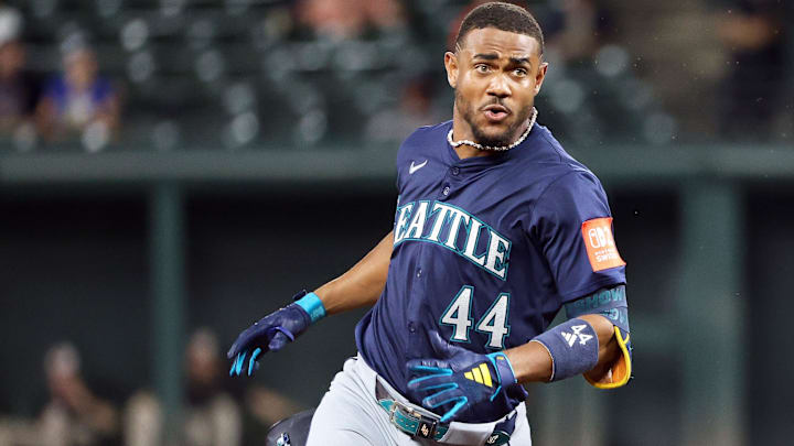 Aug 13, 2025; Baltimore, Maryland, USA; Seattle Mariners outfielder Julio Rodriguez (44) hits a triple during the seventh inning against the Baltimore Orioles at Oriole Park at Camden Yards. Mandatory Credit: Daniel Kucin Jr.-Imagn Images