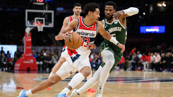 Apr 2, 2024; Washington, District of Columbia, USA; Washington Wizards guard Jordan Poole (13) drives to the basket against Milwaukee Bucks guard Malik Beasley (5) during the fourth quarter at Capital One Arena. Apr 2, 2024; Washington, District of Columbia, USA; Washington Wizards guard Jordan Poole (13) drives to the basket against Milwaukee Bucks guard Malik Beasley (5) during the fourth quarter at Capital One Arena.