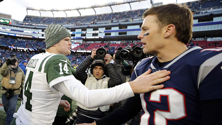 New England Patriots quarterback Tom Brady and New York Jets quarterback Sam Darnold congratulate each other.