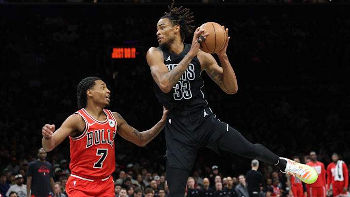 Feb 9, 2026; Brooklyn, New York, USA; Brooklyn Nets center Nic Claxton (33) is guarded by Chicago Bulls guard Rob Dillingham (7) during the second half at Barclays Center. Mandatory Credit: Vincent Carchietta-Imagn Images Feb 9, 2026; Brooklyn, New York, USA; Brooklyn Nets center Nic Claxton (33) is guarded by Chicago Bulls guard Rob Dillingham (7) during the second half at Barclays Center. Mandatory Credit: Vincent Carchietta-Imagn Images