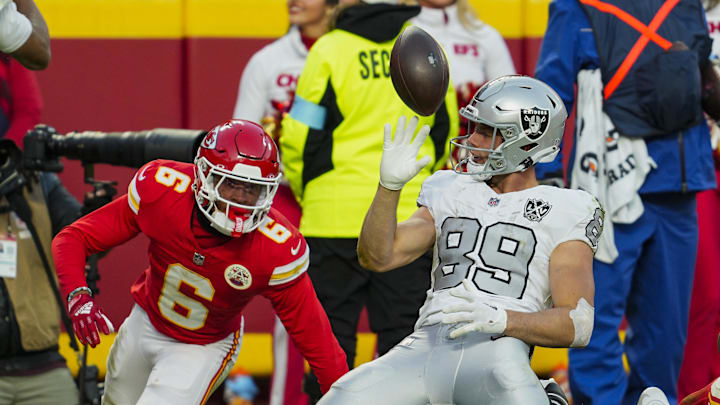 Nov 29, 2024; Kansas City, Missouri, USA; Las Vegas Raiders tight end Brock Bowers (89) tosses the ball after scoring a touchdown against Kansas City Chiefs safety Bryan Cook (6) during the second half at GEHA Field at Arrowhead Stadium. Mandatory Credit: Jay Biggerstaff-Imagn Images Nov 29, 2024; Kansas City, Missouri, USA; Las Vegas Raiders tight end Brock Bowers (89) tosses the ball after scoring a touchdown against Kansas City Chiefs safety Bryan Cook (6) during the second half at GEHA Field at Arrowhead Stadium. Mandatory Credit: Jay Biggerstaff-Imagn Images
