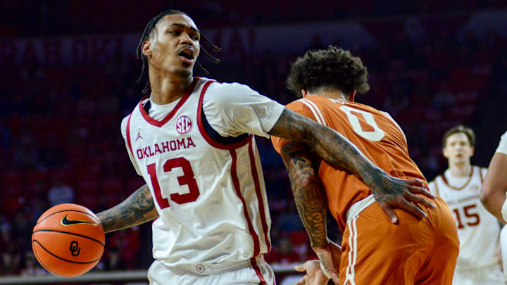 Oklahoma forward Tae Davis drives against Texas.