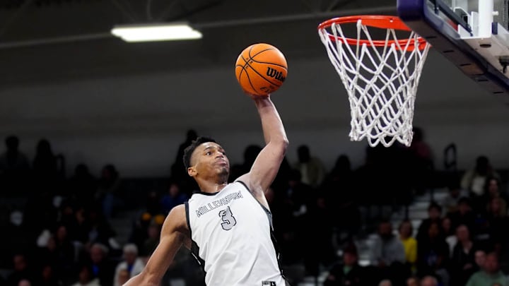 Millennium forward Cameron Holmes (3) dunks against Sunnyslope during a game at Millennium High School in Goodyear on Jan. 23, 2025.