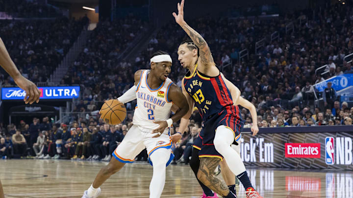 Nov 27, 2024; San Francisco, California, USA; Oklahoma City Thunder guard Shai Gilgeous-Alexander (2) drives past Golden State Warriors guard Lindy Waters III (43) during the first half at Chase Center. Mandatory Credit: John Hefti-Imagn Images