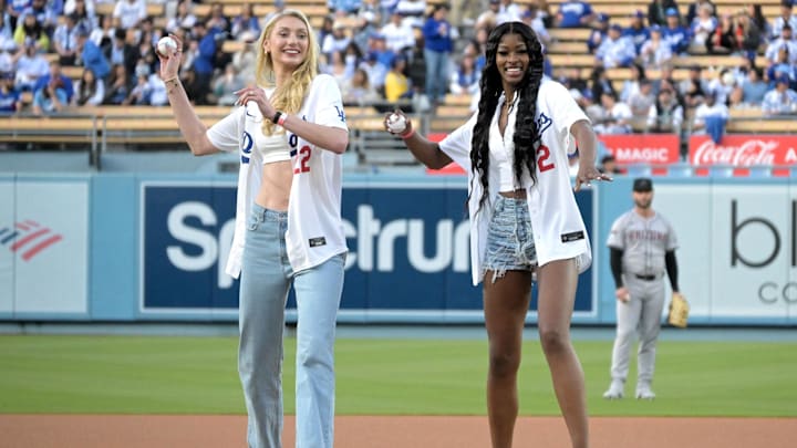 May 20, 2024; Los Angeles, California, USA; Los Angeles Sparks Cameron Brink (22) and Rickea Jackson (2) throw out the first pitch prior to the game between the Los Angeles Dodgers and the Arizona Diamondbacks at Dodger Stadium. Mandatory Credit: Jayne Kamin-Oncea-Imagn Images