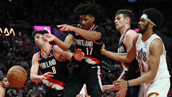 Mar 25, 2025; Portland, Oregon, USA; Portland Trail Blazers forward Deni Avdija (8), guard Shaedon Sharpe (17), center Donovan Clingan (23) and Cleveland Cavaliers center Jarrett Allen (31) fight for a loose ball in the first half at Moda Center. Mandatory Credit: Jaime Valdez-Imagn Images Mar 25, 2025; Portland, Oregon, USA; Portland Trail Blazers forward Deni Avdija (8), guard Shaedon Sharpe (17), center Donovan Clingan (23) and Cleveland Cavaliers center Jarrett Allen (31) fight for a loose ball in the first half at Moda Center. Mandatory Credit: Jaime Valdez-Imagn Images