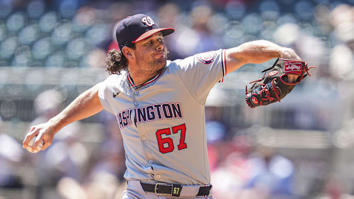 Aug 25, 2024; Cumberland, Georgia, USA; Washington Nationals relief pitcher Kyle Finnegan (67) pitches against the Atlanta Braves during the ninth inning at Truist Park. Aug 25, 2024; Cumberland, Georgia, USA; Washington Nationals relief pitcher Kyle Finnegan (67) pitches against the Atlanta Braves during the ninth inning at Truist Park.