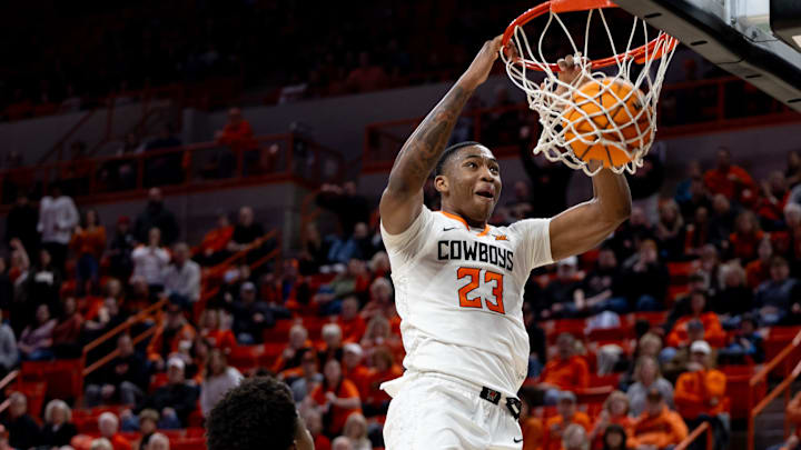 Jan 6, 2024; Stillwater, Okla, USA; Oklahoma State Cowboys center Brandon Garrison (23) slam dunks.