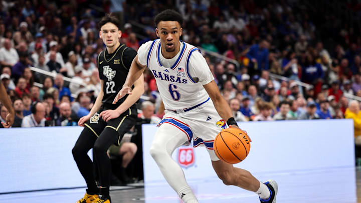 Mar 12, 2025; Kansas City, MO, USA; Kansas Jayhawks guard Rylan Griffen (6) drives to the basket during the first half against the UCF Knights at T-Mobile Center. Mandatory Credit: William Purnell-Imagn Images