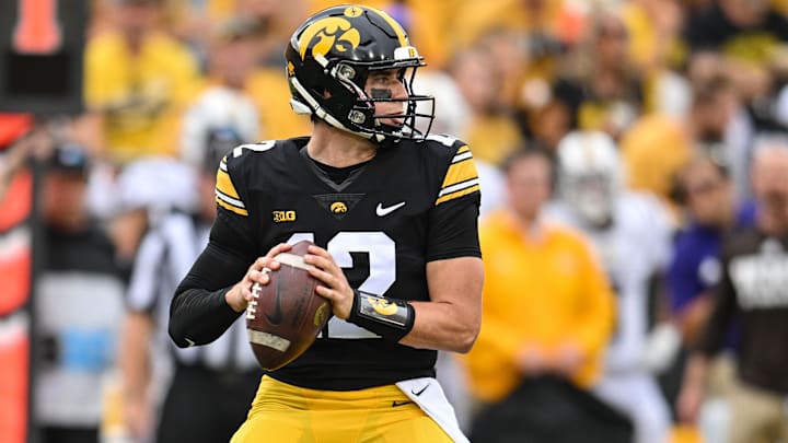 Sep 16, 2023; Iowa City, Iowa, USA; Iowa Hawkeyes quarterback Cade McNamara (12) throws a pass against the Western Michigan Broncos during the game at Kinnick Stadium. Mandatory Credit: Jeffrey Becker-USA TODAY Sports