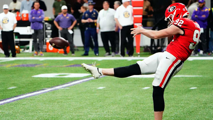 Dec 3, 2022; Atlanta, GA, USA; Georgia Bulldogs punter Brett Thorson (92) punting during the first quarter against the Georgia Bulldogs in the SEC Championship game at Mercedes-Benz Stadium. Mandatory Credit: John David Mercer-Imagn Images