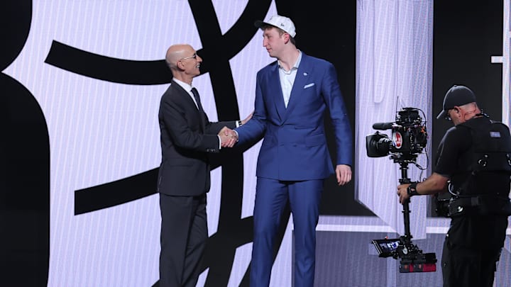 Jun 25, 2025; Brooklyn, NY, USA;  Danny Wolf stands with NBA commissioner Adam Silver after being selected as the 27th pick by the Brooklyn Nets in the first round of the 2025 NBA Draft at Barclays Center. Mandatory Credit: Brad Penner-Imagn Images
