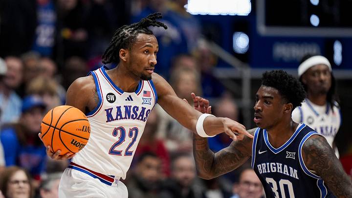 Jan 31, 2026; Lawrence, Kansas, USA; Kansas Jayhawks guard Darryn Peterson (22) gestures to a teammate as BYU Cougars forward Kennard Davis Jr. (30) defends during the first half at Mizzou Arena. Mandatory Credit: Jay Biggerstaff-Imagn Images Jan 31, 2026; Lawrence, Kansas, USA; Kansas Jayhawks guard Darryn Peterson (22) gestures to a teammate as BYU Cougars forward Kennard Davis Jr. (30) defends during the first half at Mizzou Arena. Mandatory Credit: Jay Biggerstaff-Imagn Images