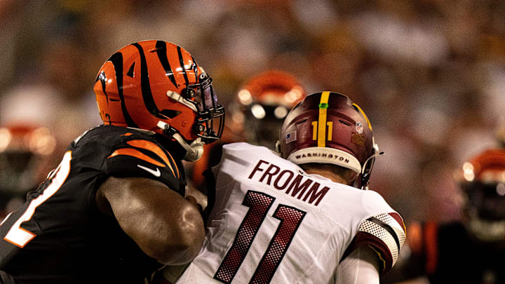 Cincinnati Bengals defensive tackle Domenique Davis (72) hits Washington Commanders quarterback Jake Fromm (11) in the fourth quarter of the NFL preseason week 3 game between the Cincinnati Bengals and the Washington Commanders at FedEx Field in Landover, M.D., on Saturday, Aug. 26, 2023.