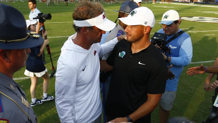 Sep 20, 2025; Oxford, Mississippi, USA; Mississippi Rebels head coach Lane Kiffin (left) and Tulane Green Wave head coach Jon Sumrall (right) embrace after the game at Vaught-Hemingway Stadium. Mandatory Credit: Petre Thomas-Imagn Images