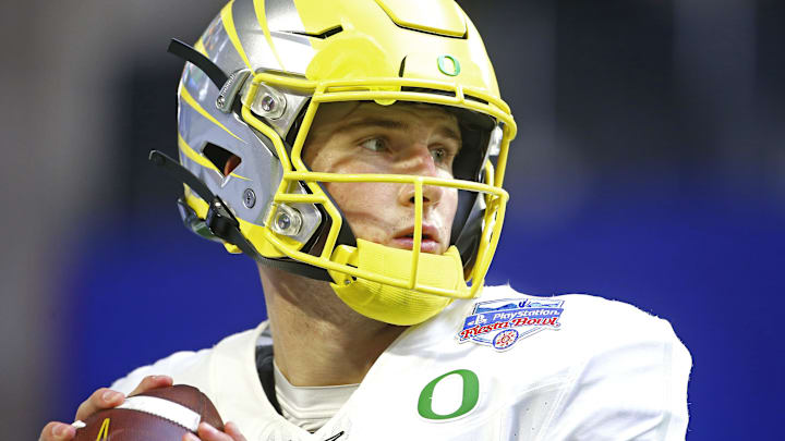 Jan 2, 2021; Glendale, AZ, USA; Oregon's Tyler Shough (12) throws passes before the Fiesta Bowl game against Iowa State at State Farm Stadium. Mandatory Credit: Patrick Breen-Arizona Republic

Ncaa Football Oregon At Iowa State