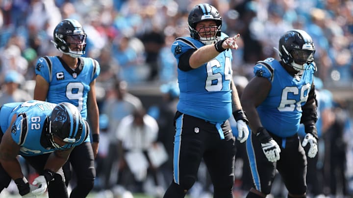 Carolina Panthers center Cade Mays (64) calls a play during the second half of a game 
