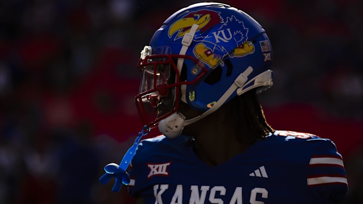 Nov 23, 2024; Kansas City, Missouri, USA;  Kansas linebacker Jon Jon Kamara (33) during warms up during pregame prior to the game between the Kansas Jayhawks and the Colorado Buffaloes at GEHA Field at Arrowhead Stadium. 