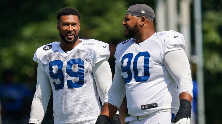 Indianapolis Colts defensive tackle Grover Stewart (90) and Indianapolis Colts defensive tackle DeForest Buckner (99) walk onto the field Sunday, Aug. 10, 2025, during Indianapolis Colts Training Camp at Grand Park in Westfield.