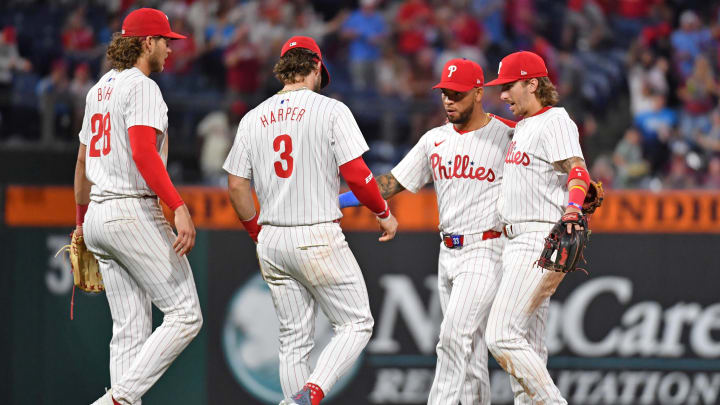 May 22, 2024; Philadelphia, Pennsylvania, USA; Philadelphia Phillies third base Alec Bohm (28), first base Bryce Harper (3), shortstop Edmundo Sosa (33) and second base Bryson Stott (5) celebrate win against the Texas Rangers at Citizens Bank Park. May 22, 2024; Philadelphia, Pennsylvania, USA; Philadelphia Phillies third base Alec Bohm (28), first base Bryce Harper (3), shortstop Edmundo Sosa (33) and second base Bryson Stott (5) celebrate win against the Texas Rangers at Citizens Bank Park.