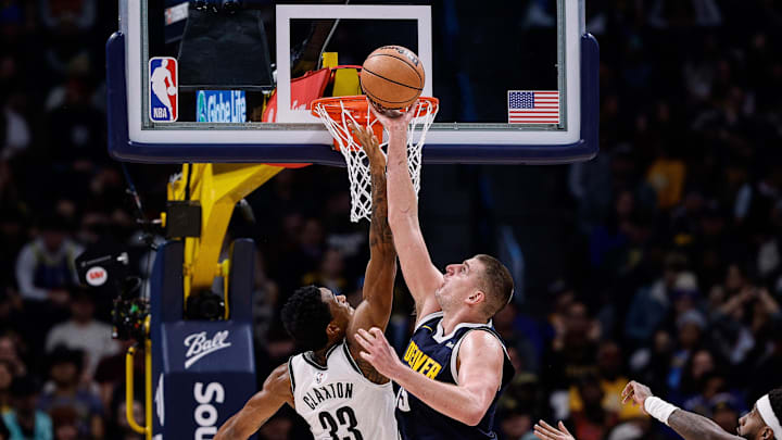 Dec 14, 2023; Denver, Colorado, USA; Brooklyn Nets center Nic Claxton (33) and Denver Nuggets center