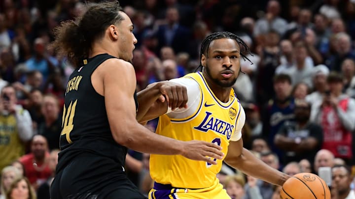 Oct 30, 2024; Cleveland, Ohio, USA; Los Angeles Lakers guard Bronny James (9) drives to the basket against Cleveland Cavaliers forward Jaylon Tyson (24) during the second half at Rocket Mortgage FieldHouse. Mandatory Credit: Ken Blaze-Imagn Images