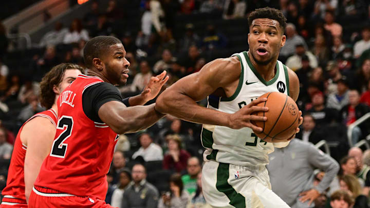Oct 14, 2024; Milwaukee, Wisconsin, USA;  Milwaukee Bucks forward Giannis Antetokounmpo (34) drives past Chicago Bulls forward E.J. Liddell (32) in the third quarter at Fiserv Forum. Mandatory Credit: Benny Sieu-Imagn Images