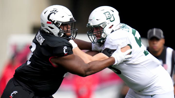 DUPLICATE***Cincinnati Bearcats wide receiver Dee Wiggins (2)***Cincinnati Bearcats defensive lineman Dontay Corleone (2) competes against Baylor Bears offensive lineman Campbell Barrington (53) in the first quarter during a college football game between the Baylor Bears and the Cincinnati Bearcats, Saturday, Oct. 21, 2023, at Nippert Stadium in Cincinnati. DUPLICATE***Cincinnati Bearcats wide receiver Dee Wiggins (2)***Cincinnati Bearcats defensive lineman Dontay Corleone (2) competes against Baylor Bears offensive lineman Campbell Barrington (53) in the first quarter during a college football game between the Baylor Bears and the Cincinnati Bearcats, Saturday, Oct. 21, 2023, at Nippert Stadium in Cincinnati.