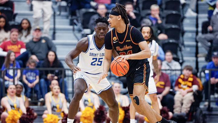 Feb 13, 2026; Chicago, Illinois, USA; Saint Louis Billikens forward Paul Otieno (25) defends against Loyola Chicago Ramblers center Miles Rubin (24) during the second half at Joseph J. Gentile Arena. Mandatory Credit: Kamil Krzaczynski-Imagn Images